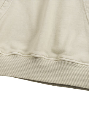 Close-up of the ribbed bottom hem on the Apricot oversized hoodie, showing the double-stitched seam line