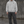 Hanorac grafic streetwear oversized Light Gray, logo original negru pe piept, față pe model masculin european