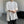 White and black padded shoulder oversized t shirt with double zippers