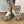 Woman wearing the Purple multicolour graffiti platform sneakers with ripped jeans, side view