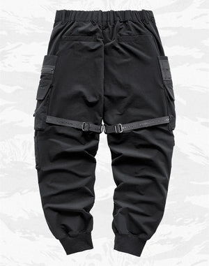 Paratrooper cargo pants techwear, side view showing thigh flap pockets
