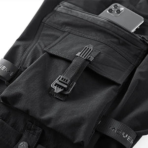 Paratrooper cargo pants techwear, close-up on elastic waist and drawcord