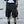 Black paratrooper techwear shorts with cargo pockets and straps