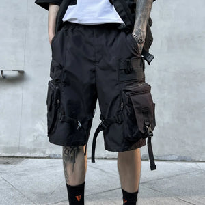 Black paratrooper techwear shorts with cargo pockets and straps