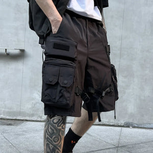 Black paratrooper techwear shorts with cargo pockets and straps