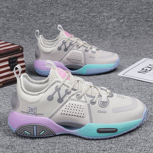 Pair of Cotton Candy basketball sneakers on grey carpet, cream upper with lilac and mint sole