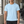 Man in the Light Blue Perforated Back Athletic T Shirt, front view in a gym with a small chest wordmark