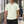 Light Green workout tee on a man in a gym, front view with crew neck and small chest wordmark