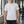 Light Gray perforated back workout tee worn front view in a gym, close fit and short sleeves