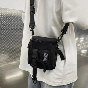 Black techwear sling bag with a dedicated phone pocket
