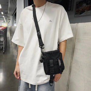 Black techwear sling bag with a dedicated phone pocket