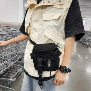 Black techwear sling bag with a dedicated phone pocket