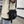 Black techwear sling bag with a dedicated phone pocket