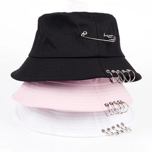 Black bucket hat with a safety pin and metal rings through the brim