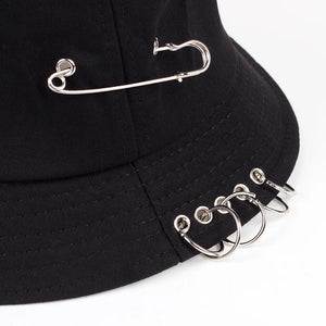 Black bucket hat with a safety pin and metal rings through the brim