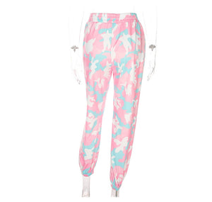Pastel pink camouflage jogger sweatpants on a ghost mannequin, front view of the elastic high waist