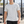 Light Gray piped seam workout t-shirt worn front view, thin black piping curving down both sides