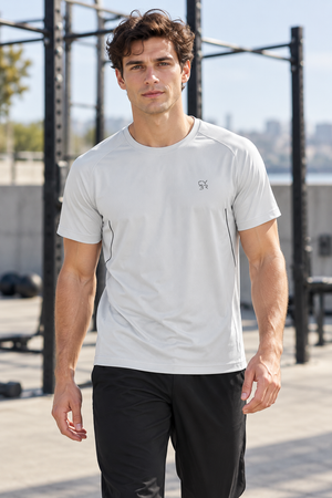 Light Gray piped seam workout t-shirt worn front view, thin black piping curving down both sides