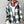Green plaid hooded jacket worn open over a white top, front view with sunglasses and ripped jeans