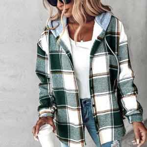 Green plaid hooded jacket worn open over a white top, front view with sunglasses and ripped jeans