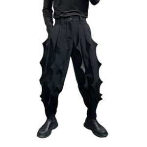 Black pleated harem pants in cotton with tassel detailing