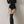 Black ribbed hooded bodysuit with polo collar and drawstring ties at the hips