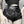 Close front view of the high waist PU leather shorts on a model, hand on hip, double chain and O-rings