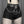 Black goth shorts worn with fishnet tights, front view of the studded belt, D-rings and moon ring