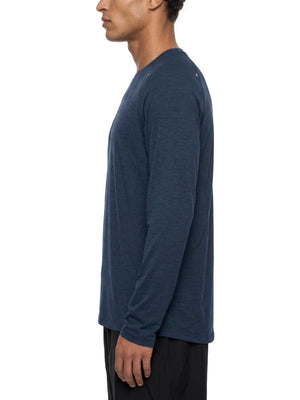 Side view of a man in the Navy Blue raglan long sleeve shirt, long sleeve and straight hem over shorts