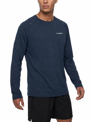 Man in the Navy Blue long sleeve gym shirt in three-quarter view, raglan sleeves and black shorts