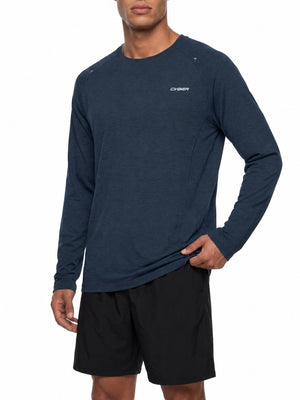 Man wearing the Navy Blue long sleeve gym shirt, hand on hip, front view with the CYBER chest print