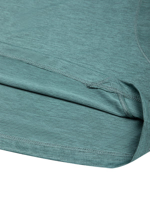 Detail of the curved panel seam meeting the hem on the Teal Green long sleeve gym shirt