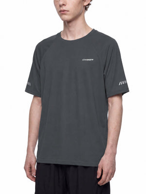 Three-quarter front view of the Dark Gray reflective raglan tee on a model, regular straight fit