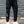 Black Reflective Stripe Techwear Joggers worn in front view, drawstring waist, cargo pockets and white sneakers