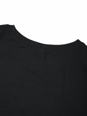 Back neckline detail of the black reflective trim gym tee, narrow collar seen from behind