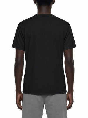 Back view of the black reflective trim gym tee on a model, plain back with grey shorts