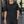 Man walking in a gym in the Black regular fit gym tee, front view with black training pants