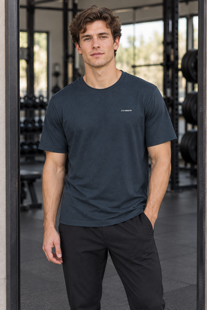 Gray Blue regular fit gym tee worn in a gym, front view showing the ribbed crew neck and straight cut