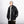 Oversized black PU leather jacket with shirt collar and front zip, three-quarter view with a beanie