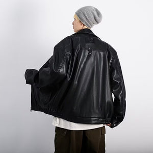 Back view of the black PU leather Y2K jacket held open, showing the yoke seam and gathered elastic hem