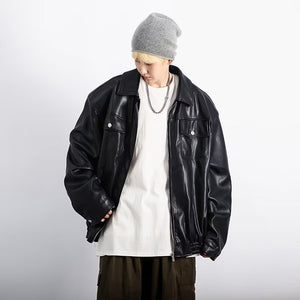 Black retro moto jacket worn open, front view looking down with the elastic hem gathered at the waist