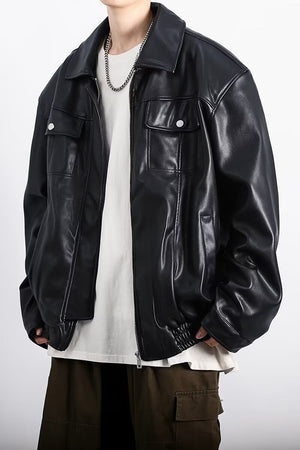 Close front view of the black Retro PU Leather Y2K Jacket, press stud chest pockets and topstitching