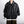 Black PU leather jacket zipped over a bag strap, front view of the zip, side pockets and elastic hem
