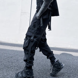 Black ribbon buckle techwear pants with an elastic waist