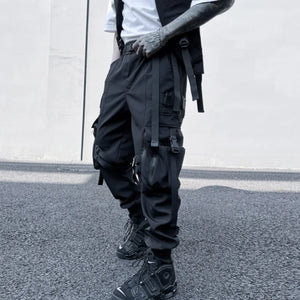 Black ribbon buckle techwear pants with an elastic waist