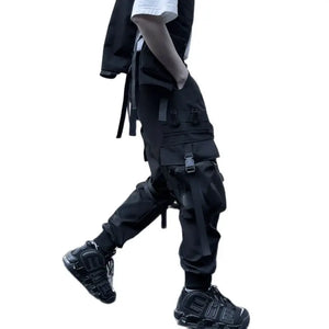 Black ribbon buckle techwear pants with an elastic waist