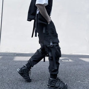 Black ribbon buckle techwear pants with an elastic waist