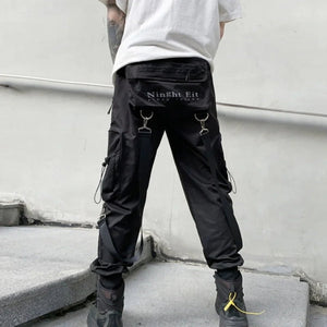 Pantalon noir à poches multiples avec patchwork de rubans