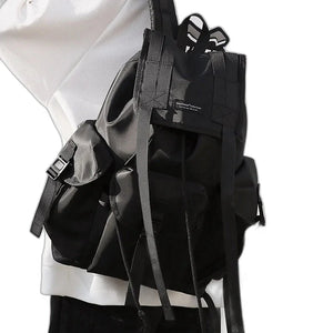 Black tactical techwear backpack with ribbon detailing, 20 to 35 litres