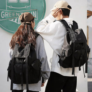 Black tactical techwear backpack with ribbon detailing, 20 to 35 litres